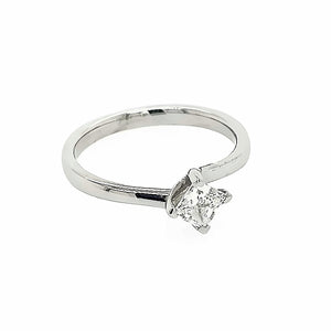 Platinum Four Claw Twist Ring Featuring Princess Cut Diamond